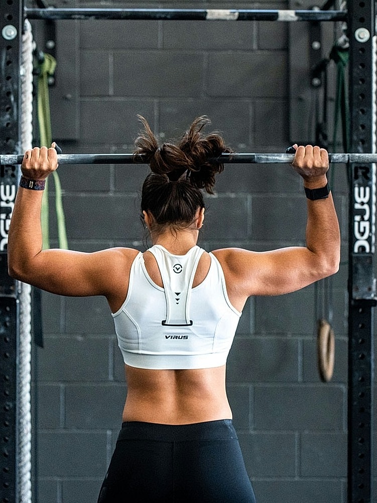 performance medicine ardmore feature - woman smiling with hands on head
